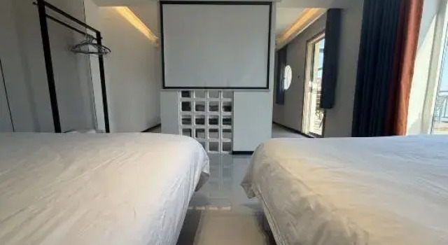 Люкс с 2 комнатами с красивым видом из окна Lianyungang One Step Away Seaview Homestay