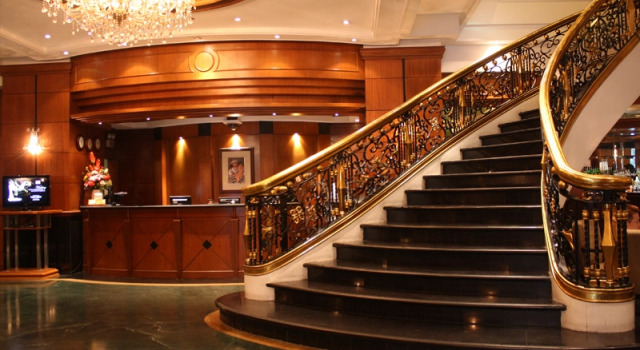Кровать в общем номере CityState Tower Hotel