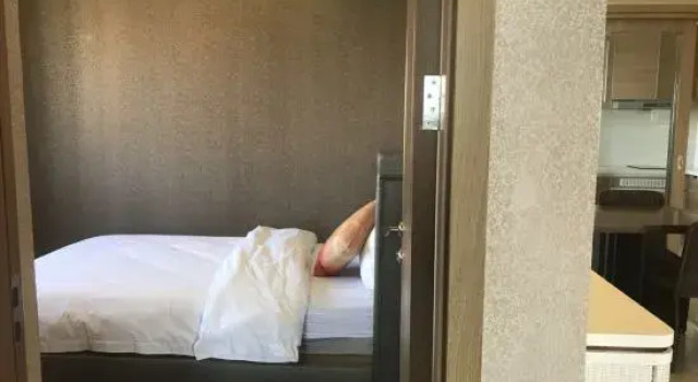 Люкс с 2 комнатами с видом на сад Yumi Holiday Apartment (Changjiang Qizi Bay)