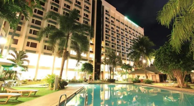 Кровать в общем номере Garden Orchid Hotel