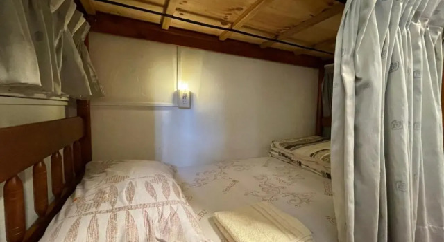 Кровать в общем номере Tainan Guest House Hamuya