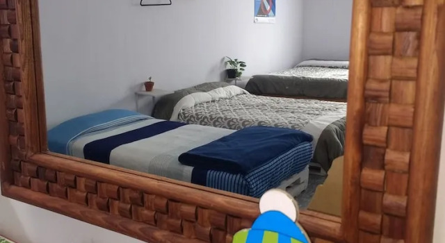 Кровать в общем номере Casa A29