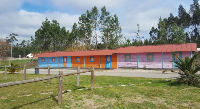 Кровать в общем номере Bungalows Landshause