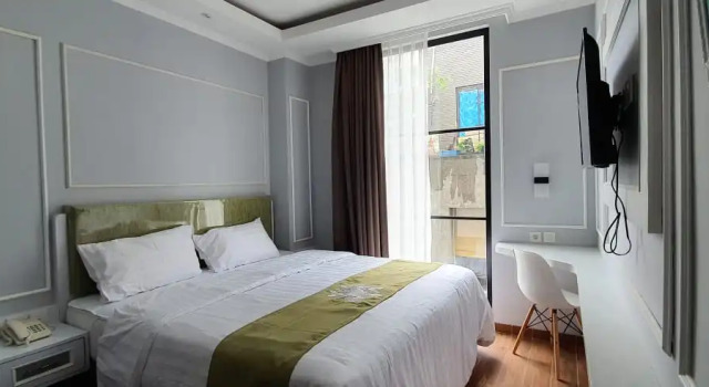 Номер Deluxe Hotel Dafam Enkadeli Thamrin Jakarta