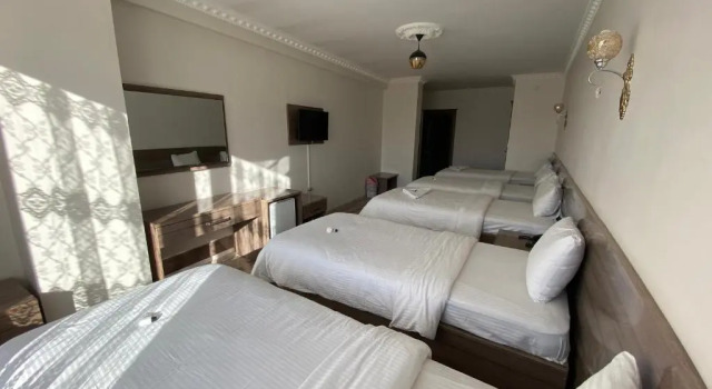 Кровать в общем номере Toprak Hotel