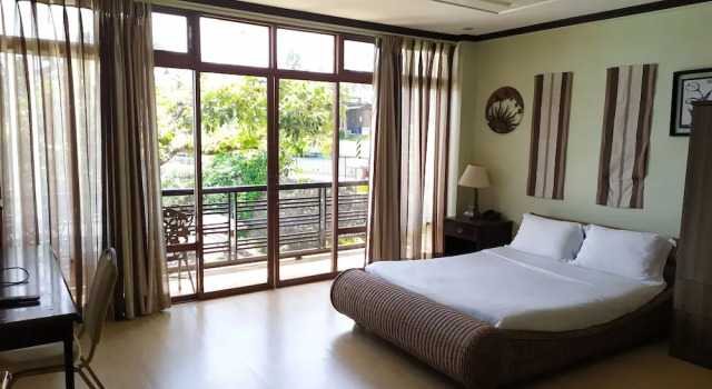 Кровать в общем номере Seascape Resort