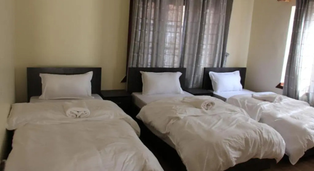 Кровать в общем номере Cozy Home B & B