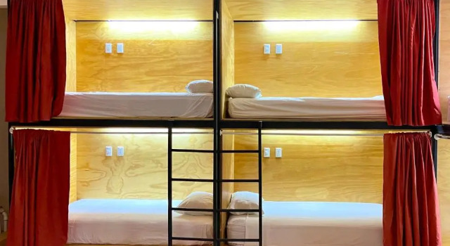 Кровать в общем номере Hotel Cerro Lodge