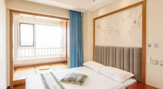Люкс с 2 комнатами с видом на море Xingwan Shibei Scenic Apartment (Development Zone Shibei Bay Fantasy Water Park)