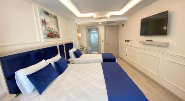 Трёхместный номер Deluxe OMMA HOTEL