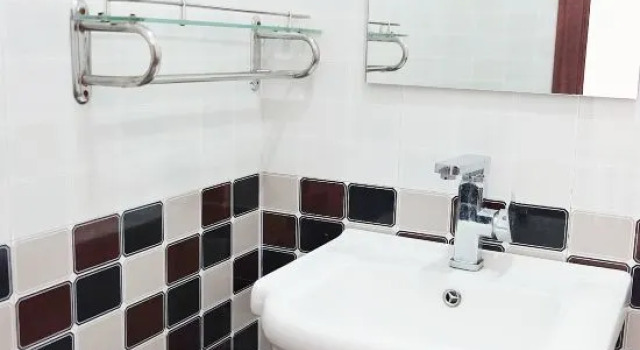 Кровать в общем номере Shouqianshou Inn