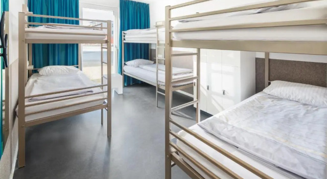 Кровать в общем номере Haus KLIPPER Norderney