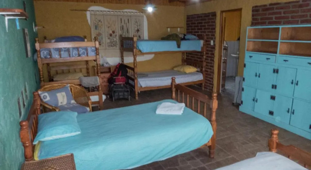 Cama en dormitorio compartido Casa Chueca - DiVino