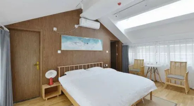 Кровать в общем номере Liuru Xiaozhu Villa
