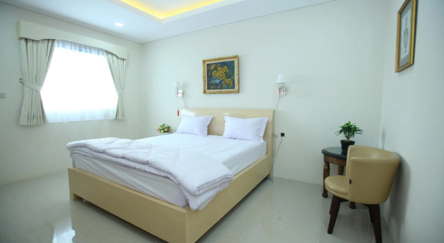 Кровать в общем номере Kemang Eleven