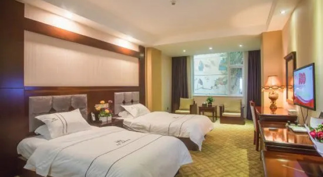 Трёхместный люкс Deluxe Duomi Chain Hotel (Lijiang Ancient City)
