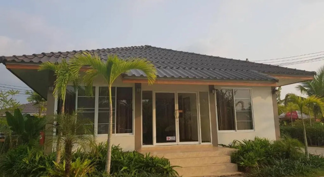 Кровать в общем номере Lamphurai Riverside Resort and Spa