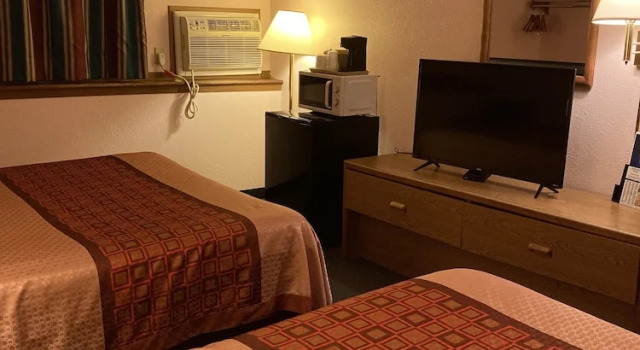 Camera quadrupla Luxury con vista sul giardino Executive Inn
