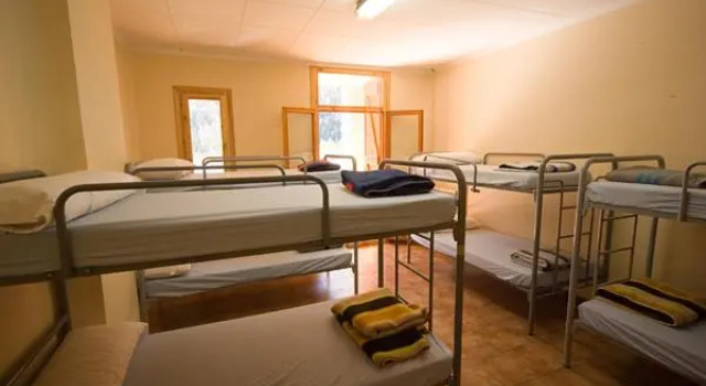 Кровать в общем номере Casa Raspa