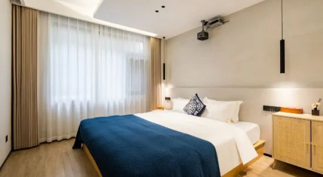 Кровать в общем номере Anji Xiyue Homestay (Yunshang Grassland Branch)