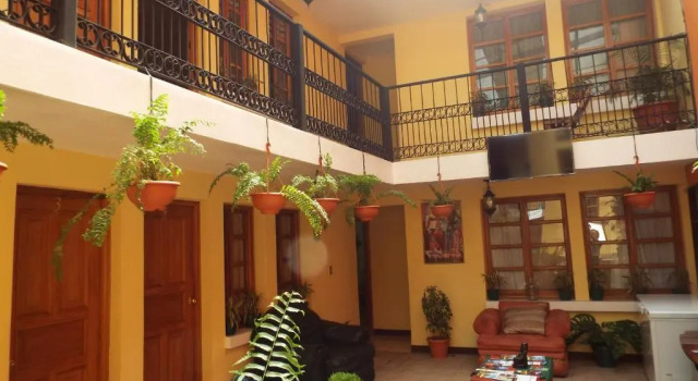 Кровать в общем номере Hotel Kasa Kamelot