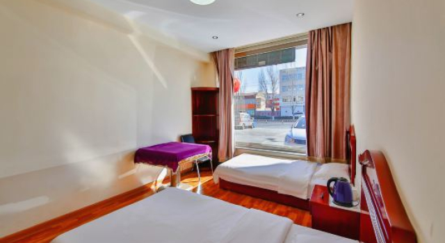 Четырёхместный люкс Deluxe Xinghe Jinjiang Business Hotel
