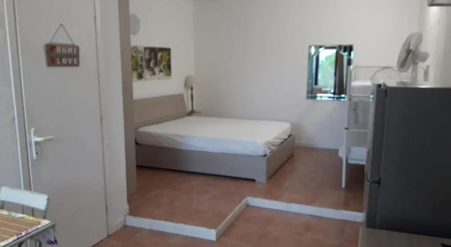Студия Monolocale Arianna con giardino privato e piscina