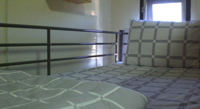 Кровать в общем номере JR Siam Inn Resort