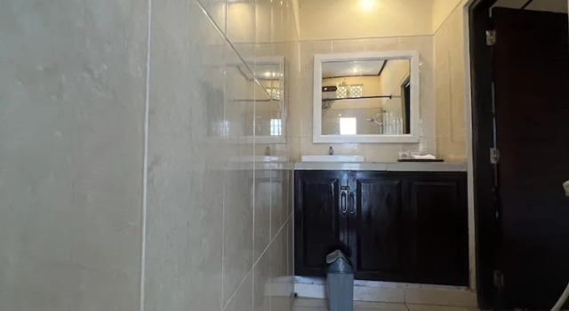 Кровать в общем номере Segara Wangi Beach Cottages