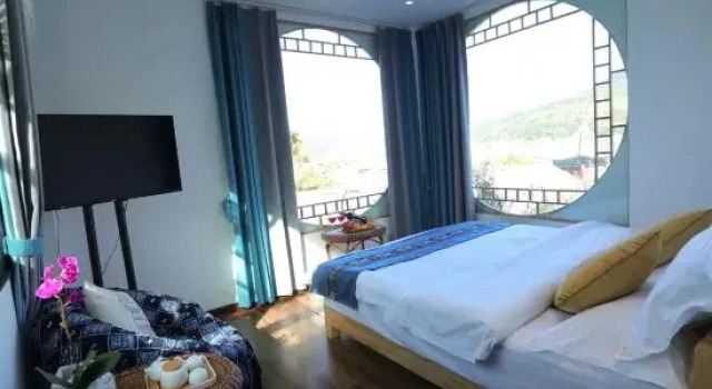 Кровать в общем номере Heshun Chuntianli Inn