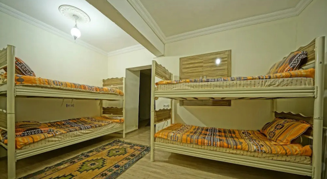Кровать в общем номере (женский номер) с балконом Glory Art Stone House