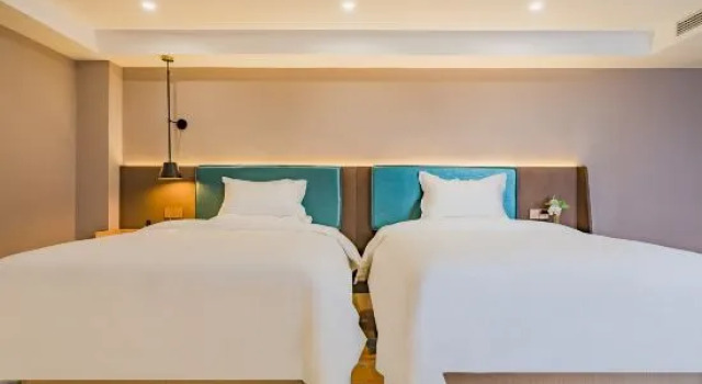 Кровать в общем номере CHEERMAY Hotel (Jiangmen Wuyi University 33 Xu Street)