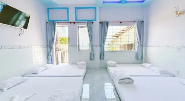 Кровать в общем номере Quoc Dinh Guest House