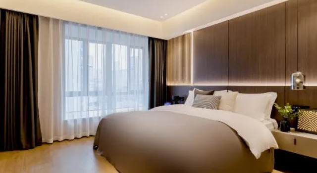 Кровать в общем номере с 5 комнатами Chengdu Laien holiday Suite Apartment