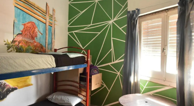 Кровать в общем номере Hostel Joven Casa Reggae