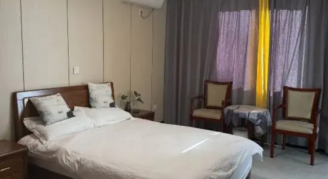 Кровать в общем номере Hongtaiyang Gourmet Home