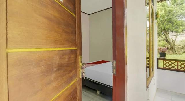 Номер Deluxe Hotel O Desa Wisata Marinsow Near Gereja Pantekosta Marinsow