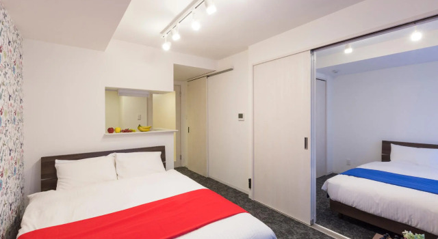 Кровать в общем номере Hotel ONES RESIDENCE