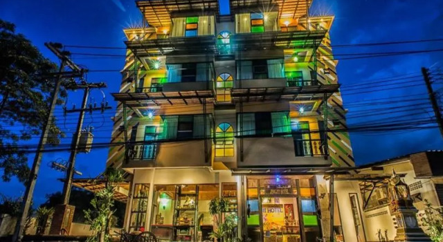 Кровать в общем номере Jingjit Hotel