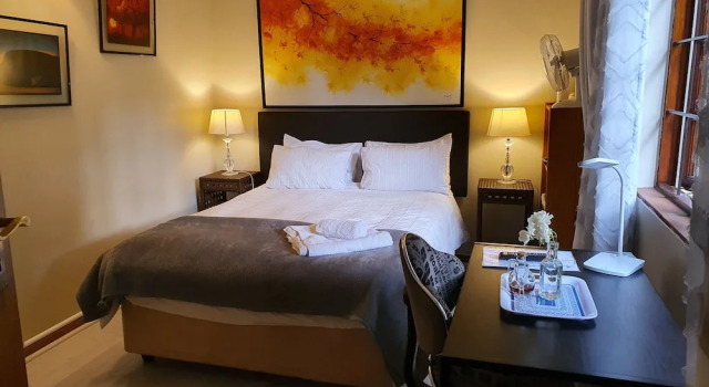 Conforto quarto com vista para o jardim Pepper Tree BnB