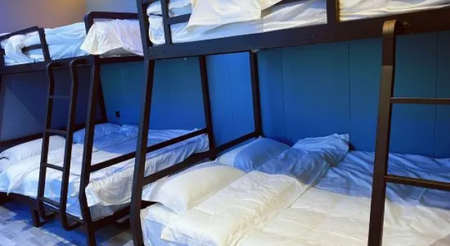 Кровать в общем номере Xi Zaomeng E-Sports Hotel (Xiyalibao Plaza)