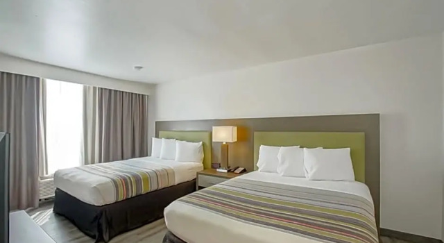 Четырёхместный люкс c 1 комнатой Country Inn & Suites by Radisson, New Orleans I-10 East, LA