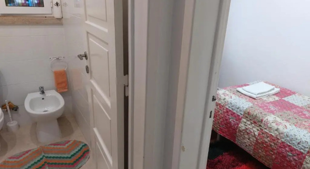 Кровать в общем номере Ameli Rooms