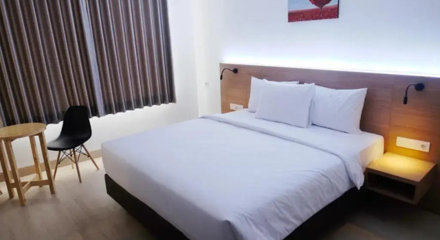 Номер Deluxe Grand Thamrin Hotel