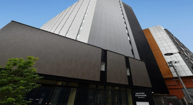Кровать в общем номере Hotel Keihan Sendai