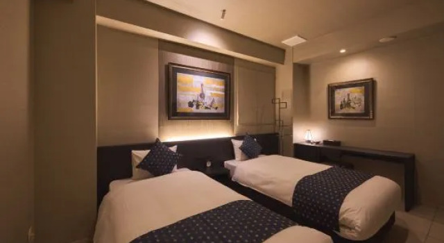 Кровать в общем номере SAKE Kura Hotel 川崎宿