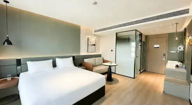 Кровать в общем номере Lihao Holiday Hotel