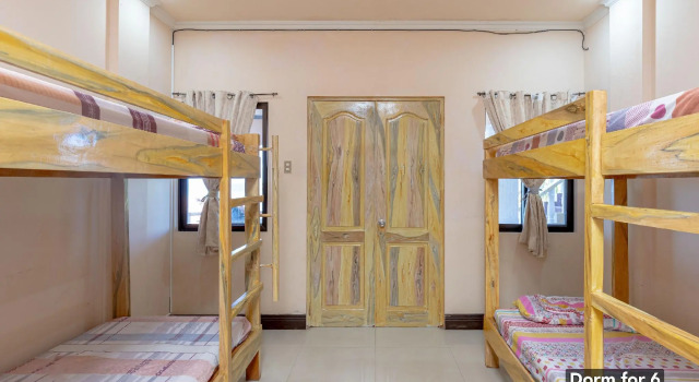 Кровать в общем номере Casa Royal Beach Front