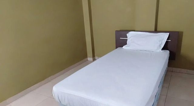 Номер Economy Hotel O Penginapan Tulimario Syariah
