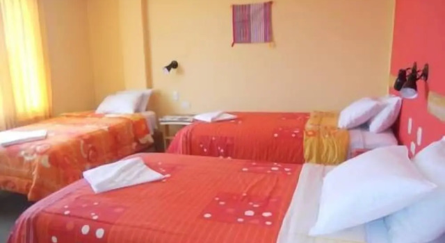 Standardowy trzyosobowy pokój i balkonem Kuntur Inn